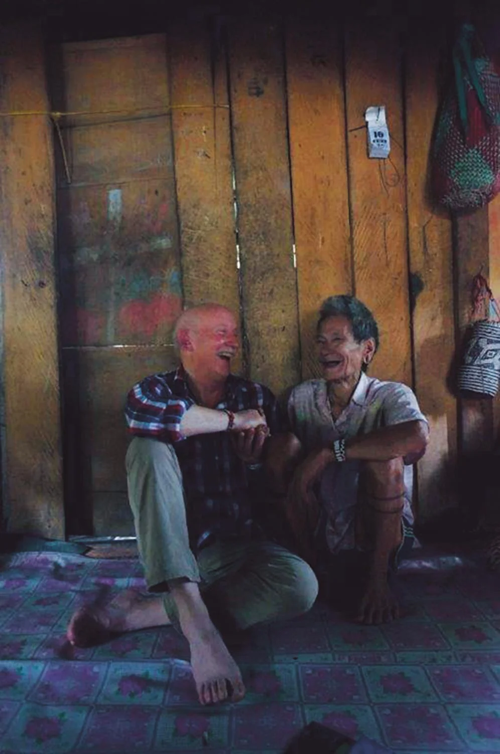 Tony Foster and Penan tribesman Nyapun share a laugh together, Mulu, Borneo, February/March 2015. Photo: Alison Pritchard