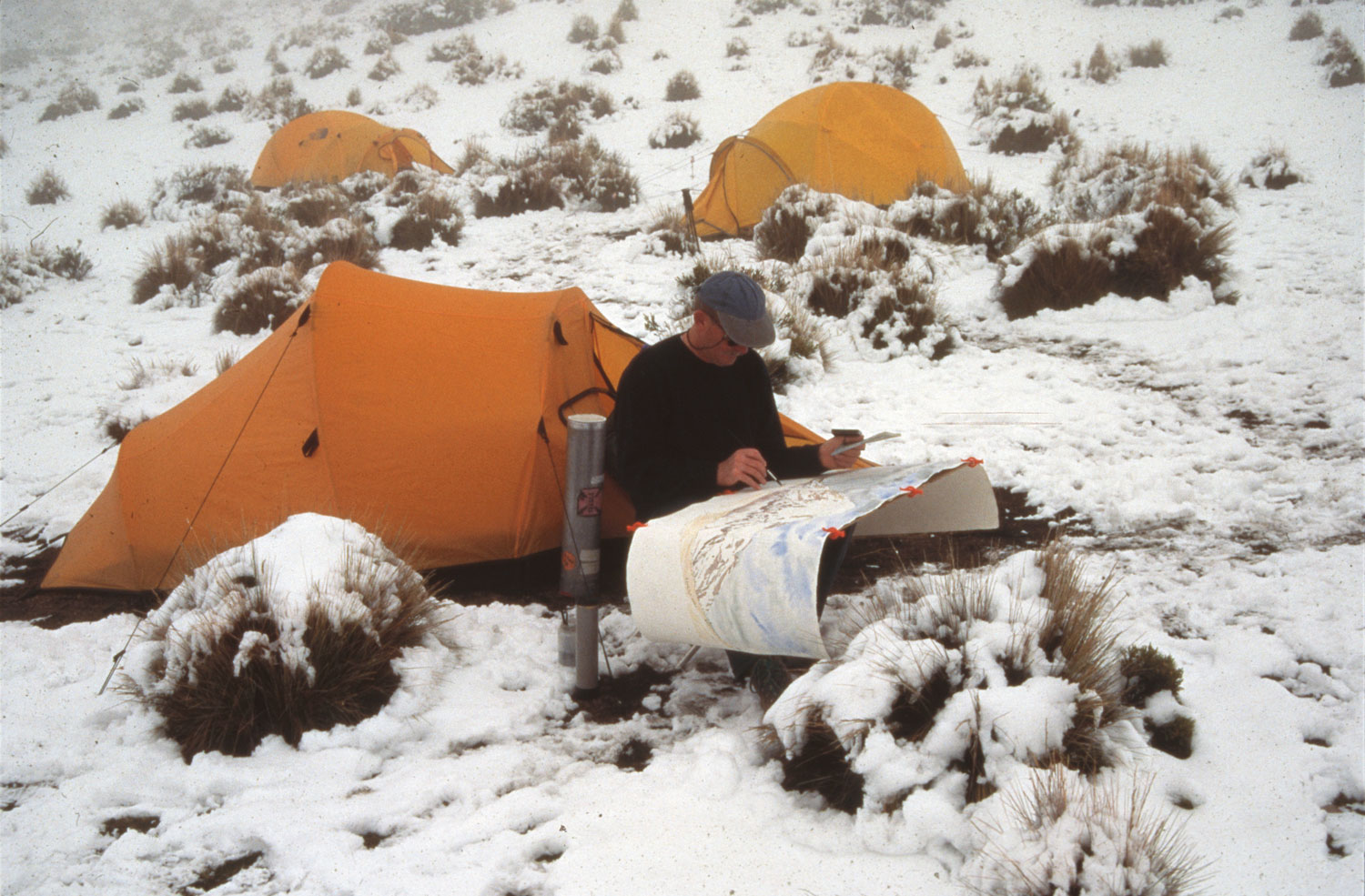 Tony Foster painting the volcano Nevado Sajama, Bolivia. 1997. Photo by Bill Vanderbilt. Courtesy of Foster Art & Wilderness Foundation.