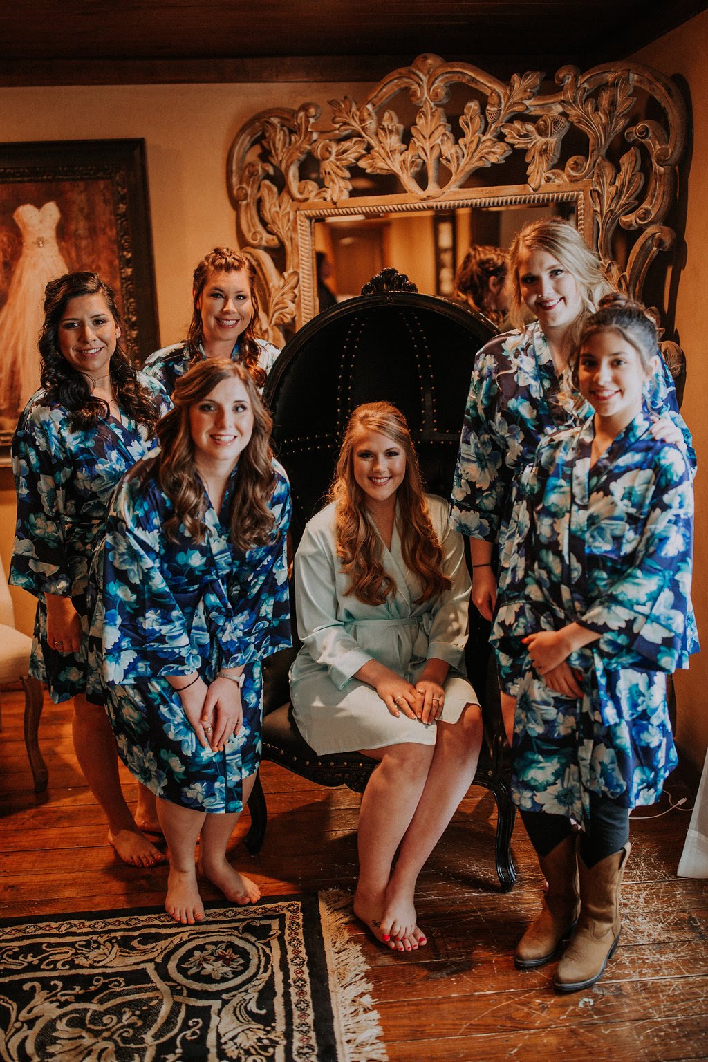 Bride and bridesmaids in robes getting ready