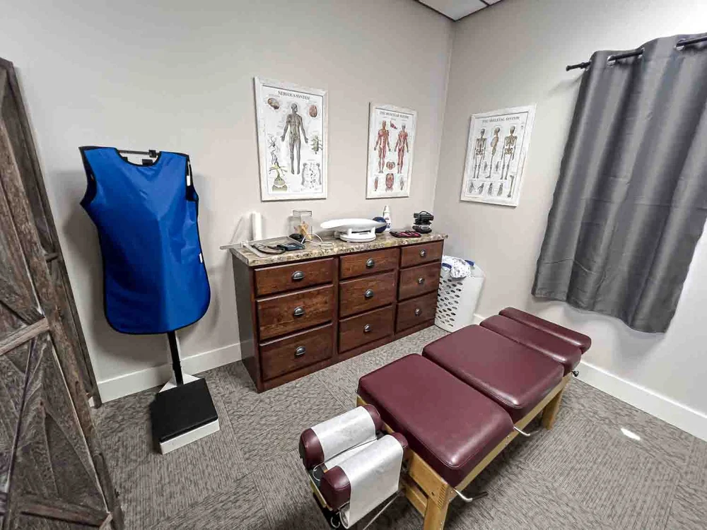 Adjusting room with drop table and X-ray apron