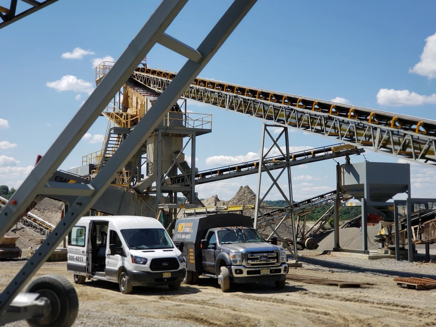Hayenhjelm Electric service vehicles at a commercial aggregate facility