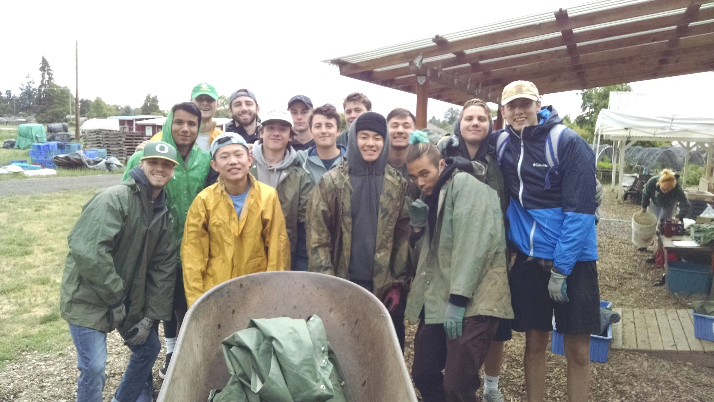 New Sigma Nu fraternity volunteers ready for a day in the rain.