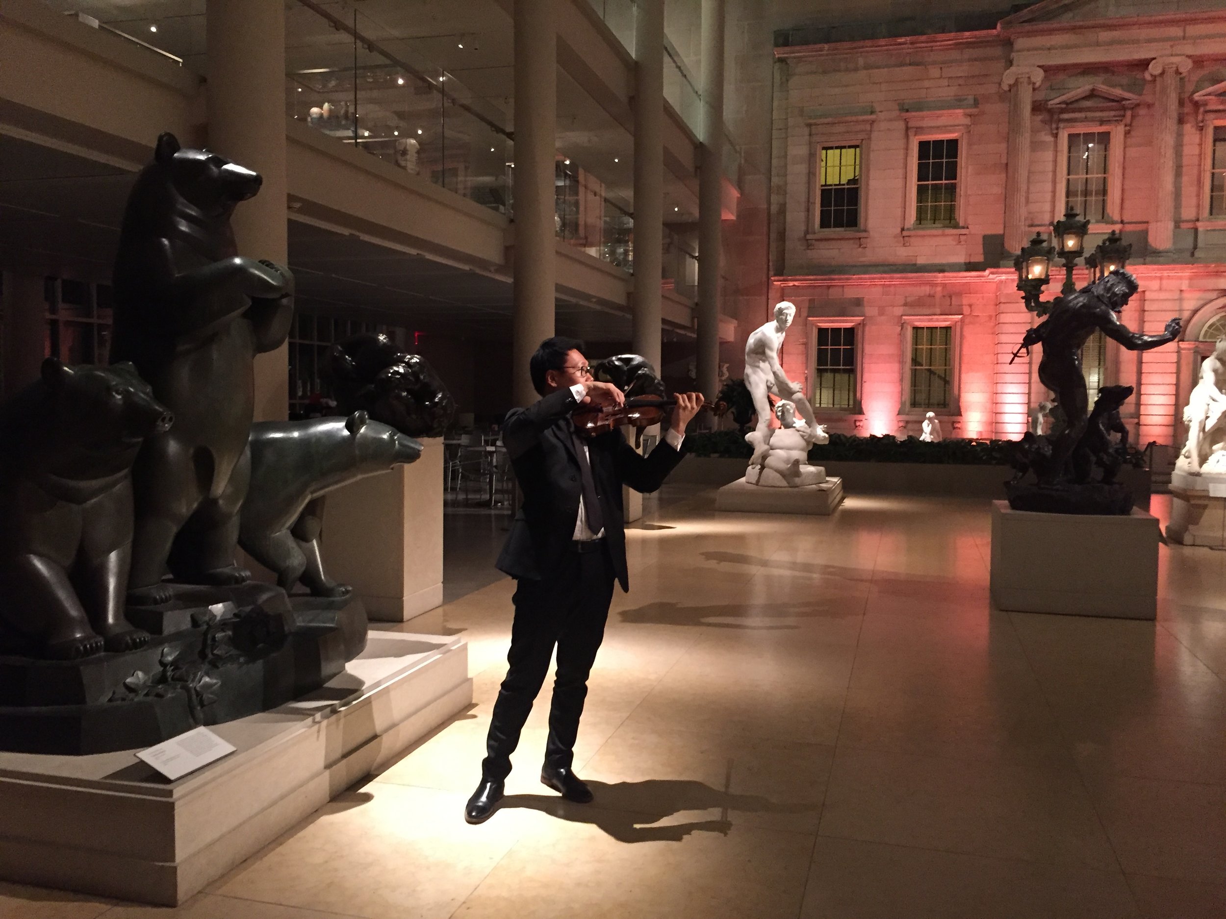 Warming up in the Americas Wing at the Metropolitan Museum of Art amidst an assortment of sculptures.