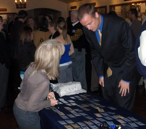 Peggy Carpenter assisting Sam Rayburn (basketball) (Kent Brewer, Track '64, can be seen in background between Peggy and Sam)