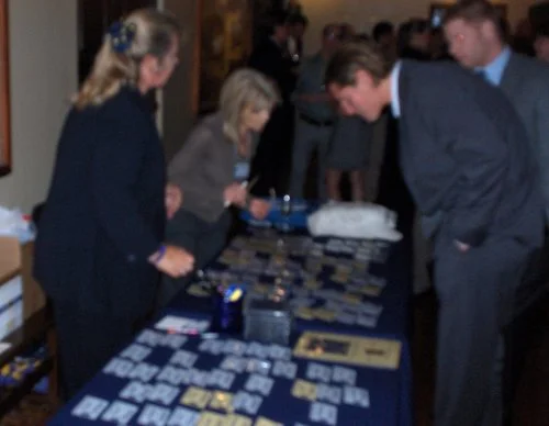 Lynn Lippstreu and Peggy Carpenter working the name tags. (Picture is blurry due to the speed at which the girls are moving!) 