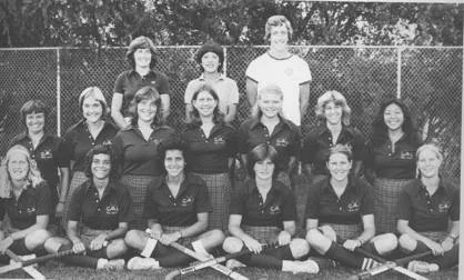 Cal's 1980 Field Hockey Team – Headed to the National Championships . . . or posing for a Toothpaste Ad? Front Row l-r: Emily Schwegman, Kim Hunter, Marcy Place, Kathy Webb, Sandi Chamberlain, Shellie Ohstead; 2nd Row : Terri Bonwell, Ester Dahl, Maureen Robbins, Melissa Nerone, Corinne Hanson, Renee Chatas, Jeanette Mori; Back Row : Clair Nicholson (Ass't Coach), Donna Fong (Head Coach), Tom Shaer (Ass't Coach).