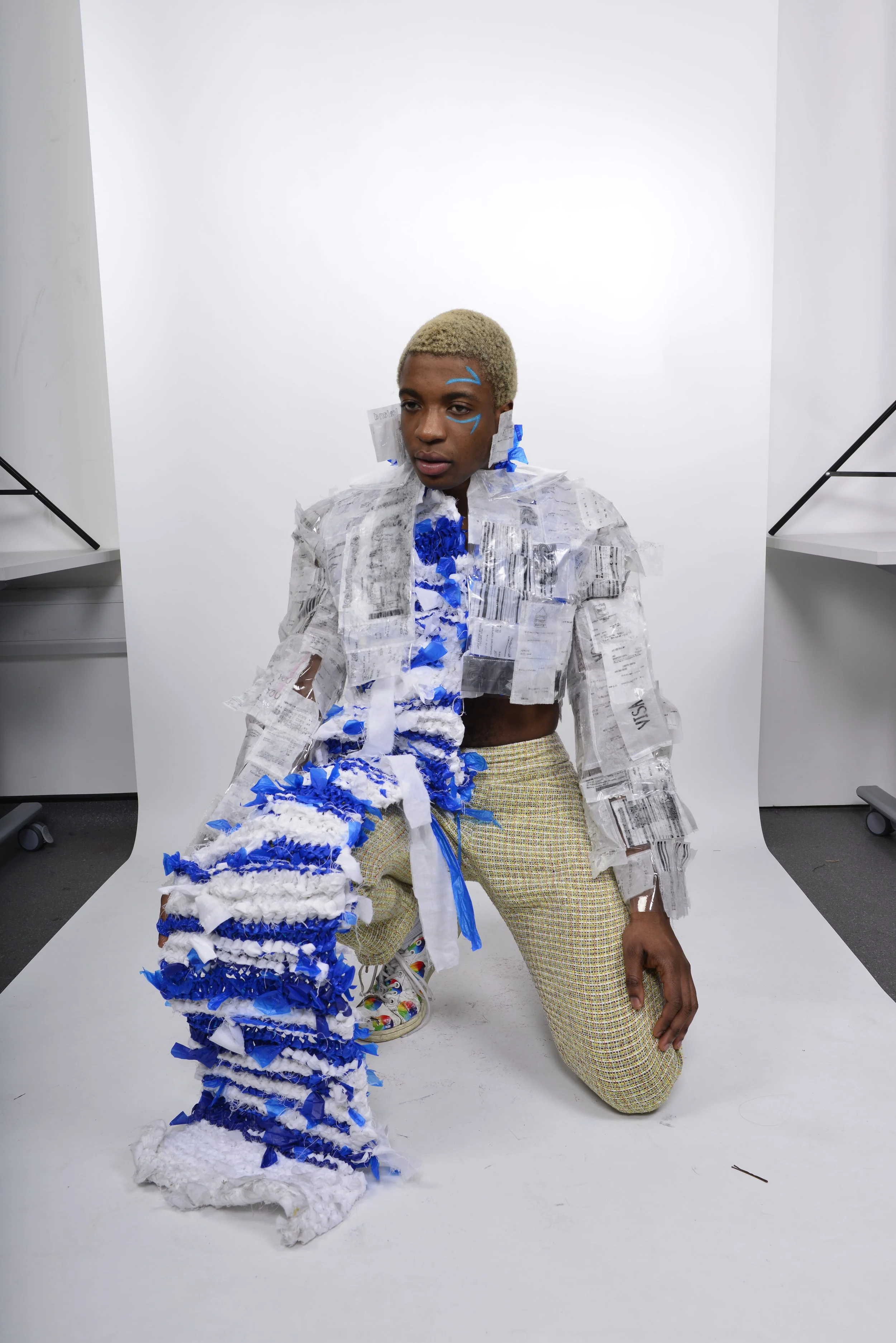  jacket - heat pressed, hand drawn receipts  wrap - knitted linen duvet / blue plastic bags  trouser - tweed     