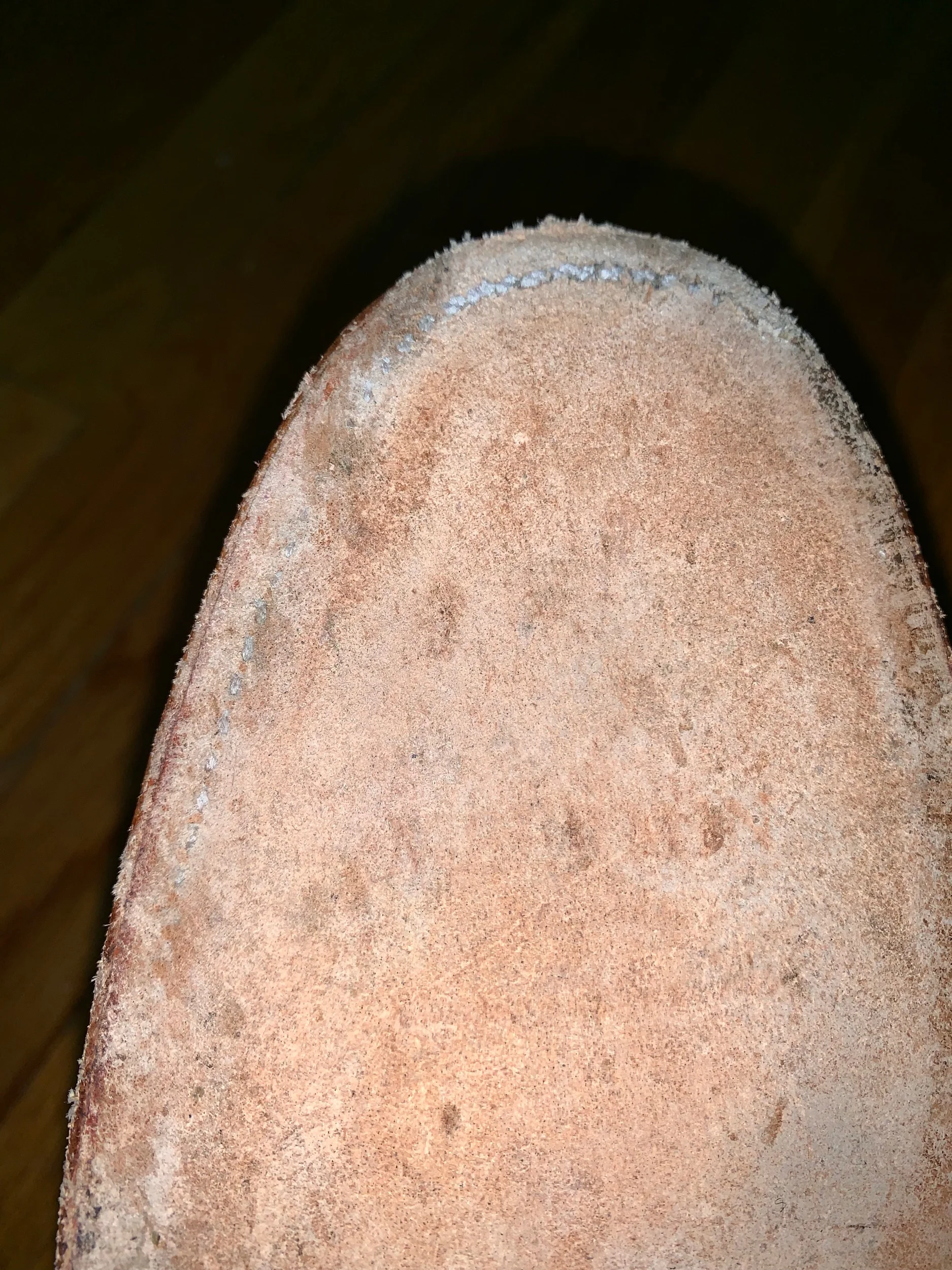 You can see that after some wear, the leather covering the goodyear welt stitch is shaved down