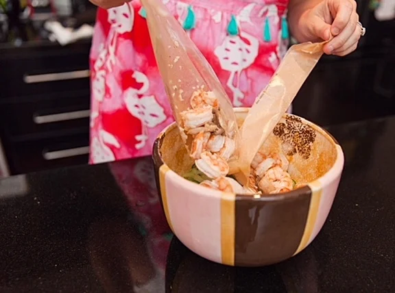 Cut the top off and pour into bowl. Wondertip: If there is excess juice, just cut a small hole in the bottom corner and drain the excess juice out of the bag but BE CAREFUL! The bag will still be very hot when you take it out of the oven! Keep those kitchen mitts on!