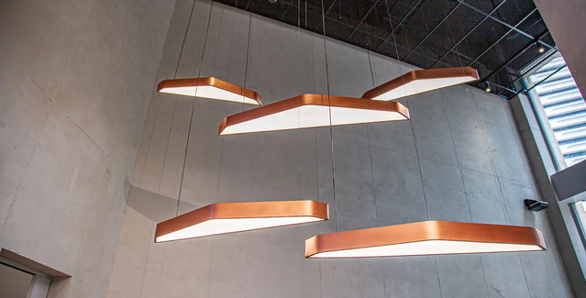  Custom pendant lights are copper paint-finished aluminium with acrylic diffusers 