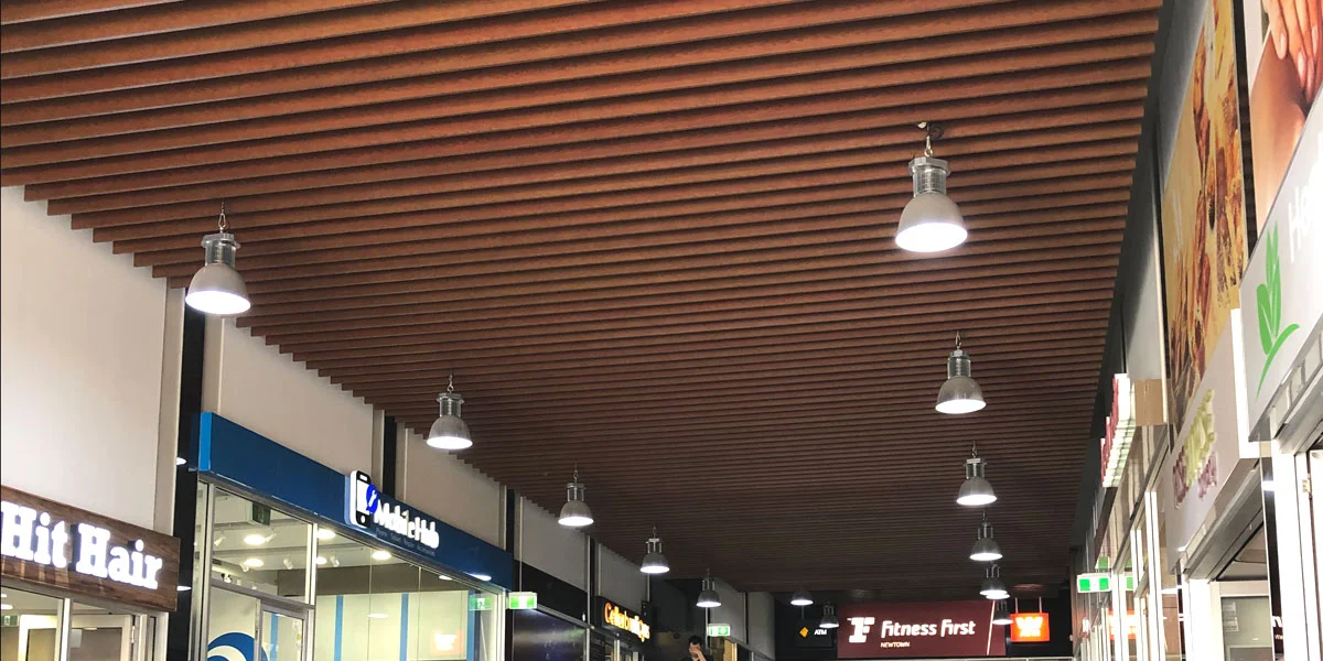  Original ceiling feature of aluminium blades with faux wood finish 