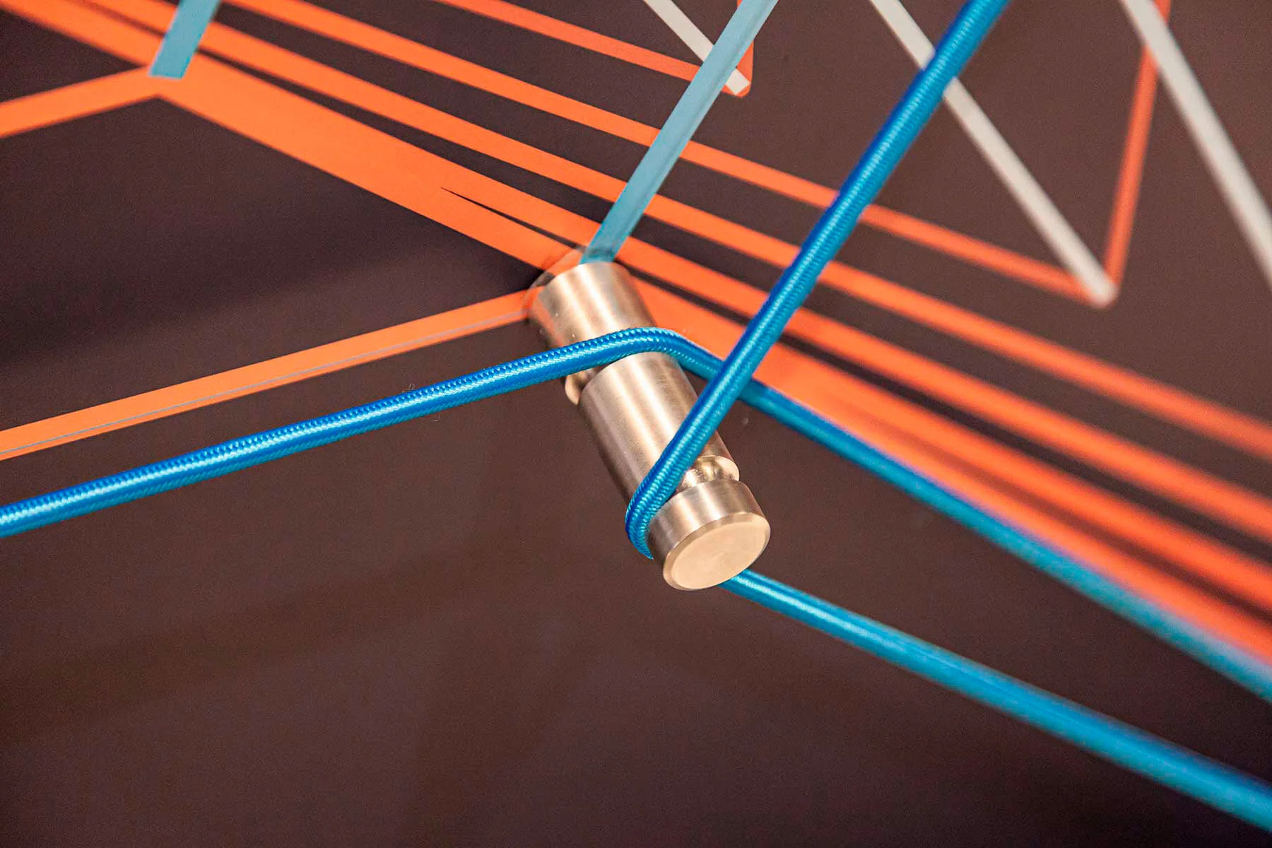 printed graphic and aluminium spigots and shock cord string art illusion