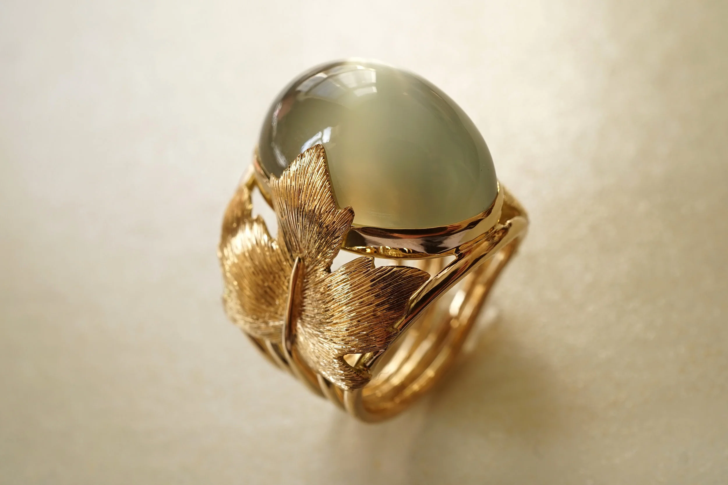 Yellow Gold 18 Carat Ring With Hand Engraved Maple Leaves And Cat Eye's Cabochon Green Moonstone