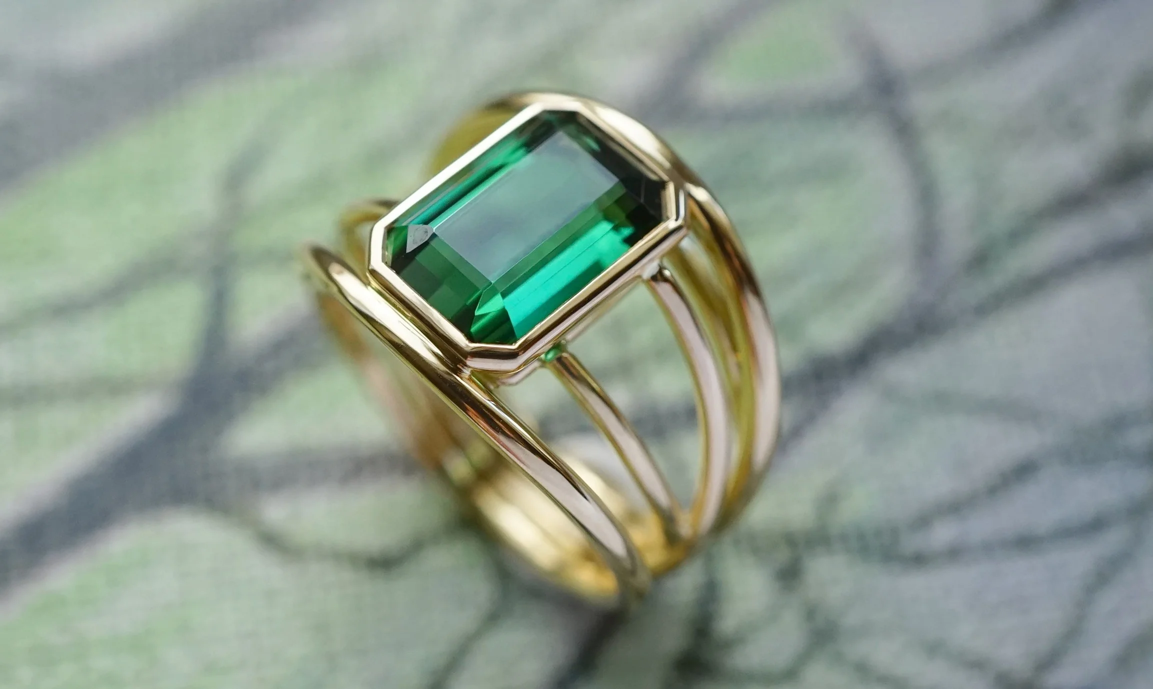 Yellow Gold 18 Carat Cord Band Ring With Green Tourmaline In Suspended Set