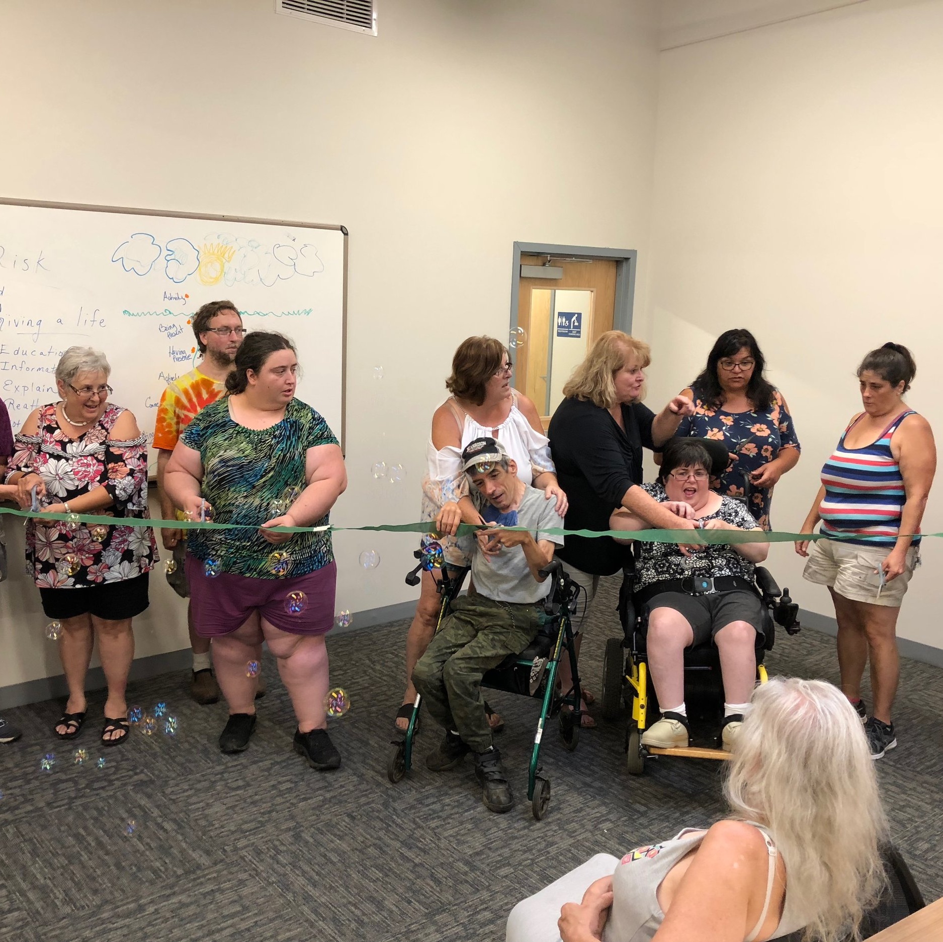 The highlight of our Open House was the ribbon cutting. Anyone associated with the agency for more than 15 years was invited to participate.