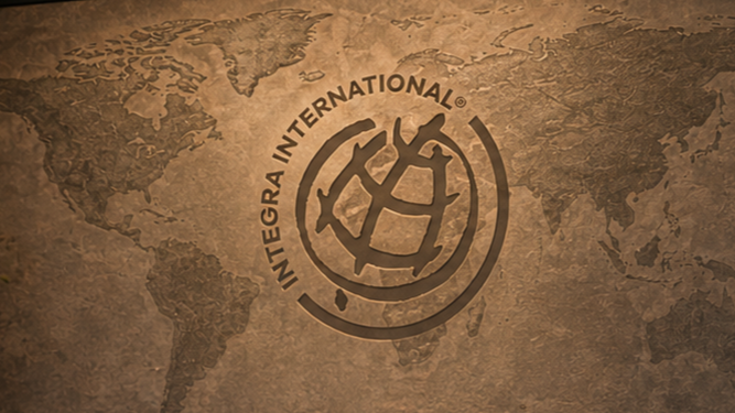 World map with the Integra International logo superimposed over it