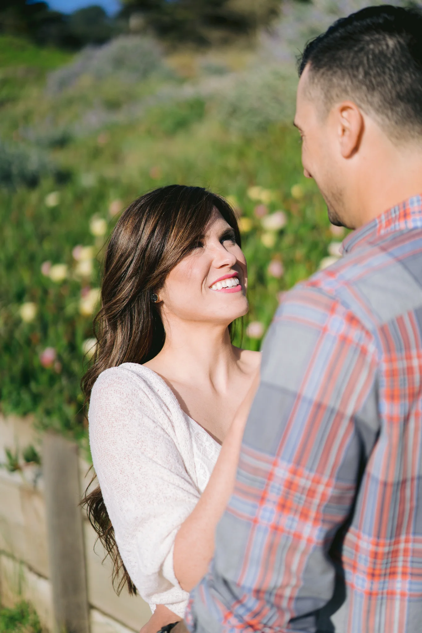 Close up of woman looking into the eyes of her fiance at San Francisco engagement photo shoot.