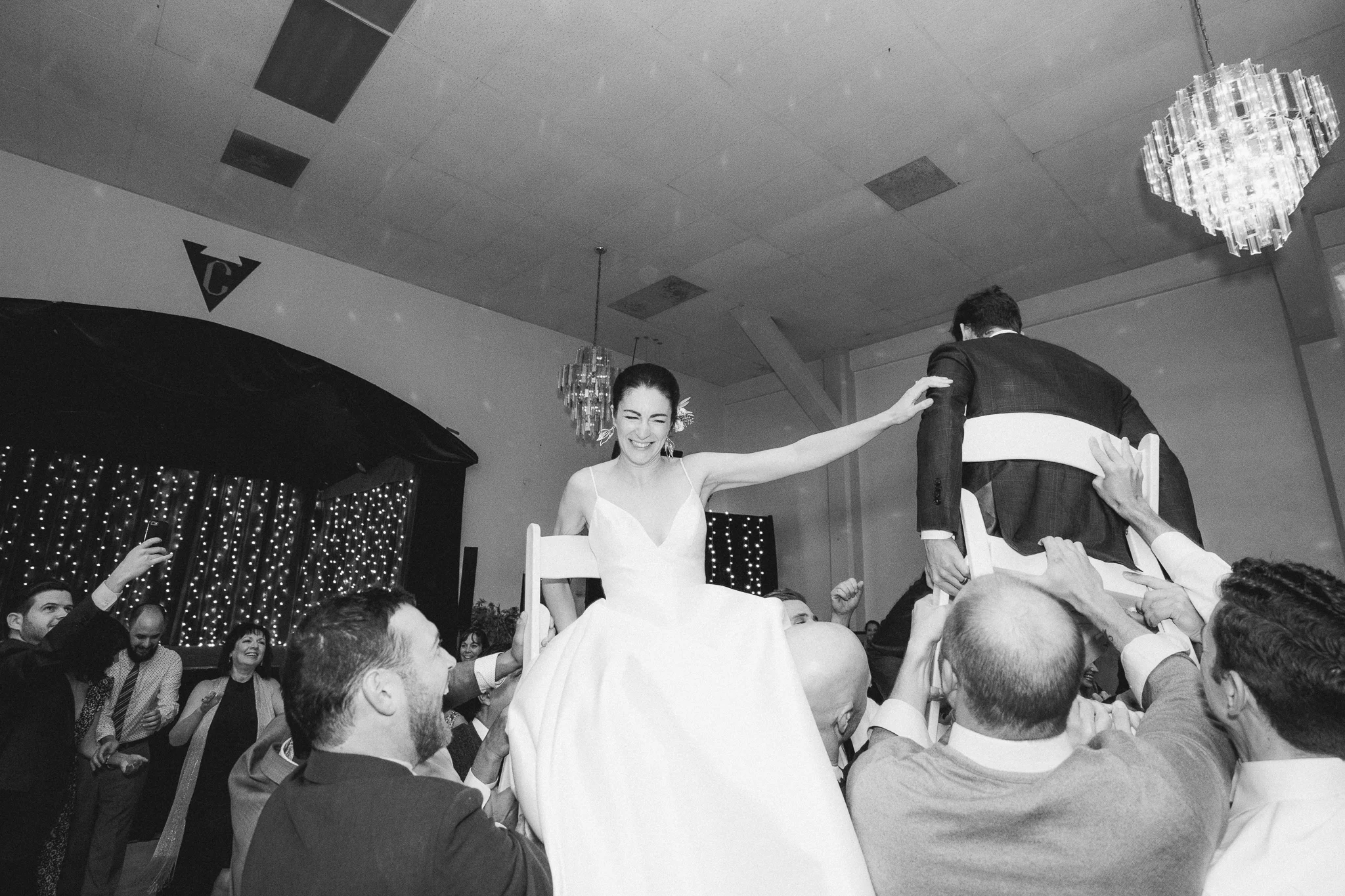 bride and groom during hora dance at verdi club wedding in san francisco, CA