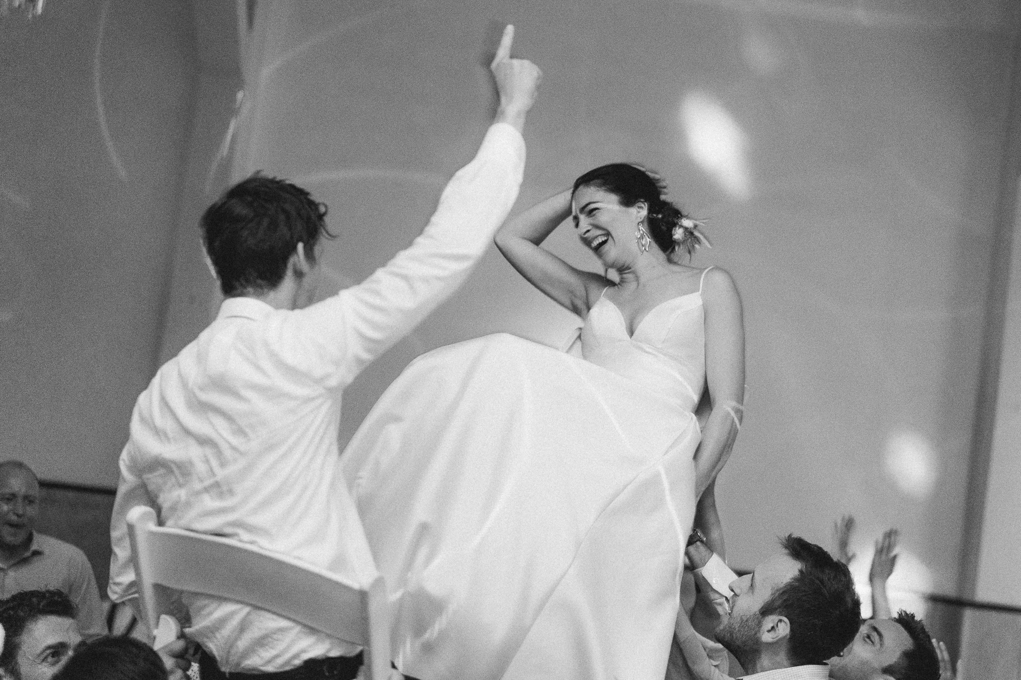 bride and groom laughing during hora dance at san francisco wedding at the verdi club.