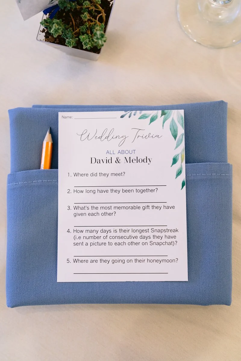 Wedding trivia card on place setting at wedding reception table at San Ramon Waters