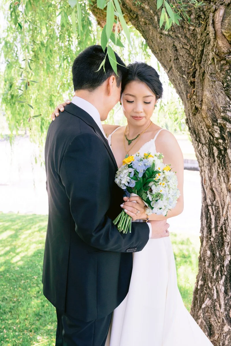 Bride and groom portraits in front of weeping willow tree at San Ramon Waters wedding