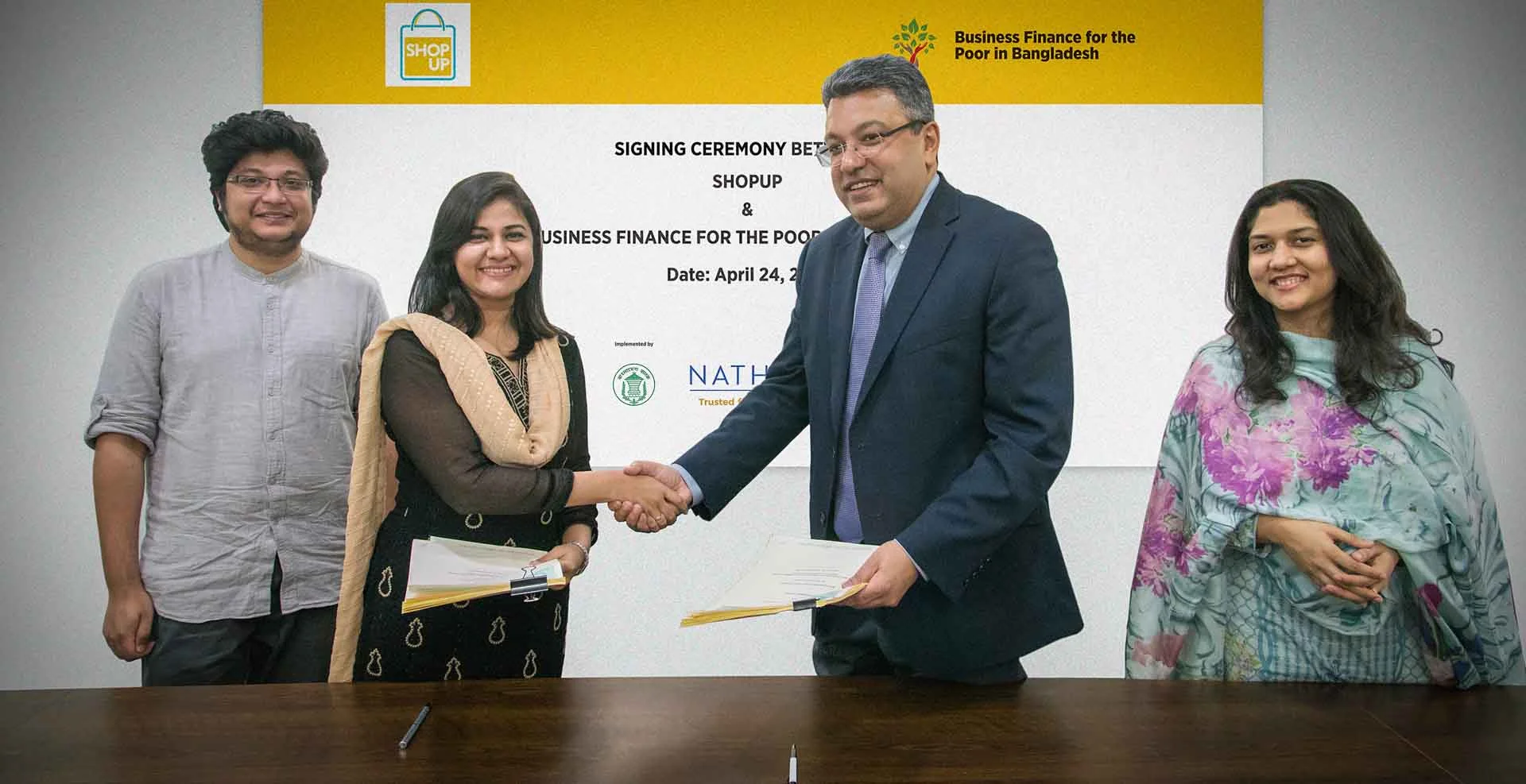ShopUp and Business Finance for the Poor in Bangladesh representatives (Project Director Buddhika Samarasinghe and Challenge Fund Coordinator Shamira Mostafa) at a Challenge Fund signing ceremony in April 2018.