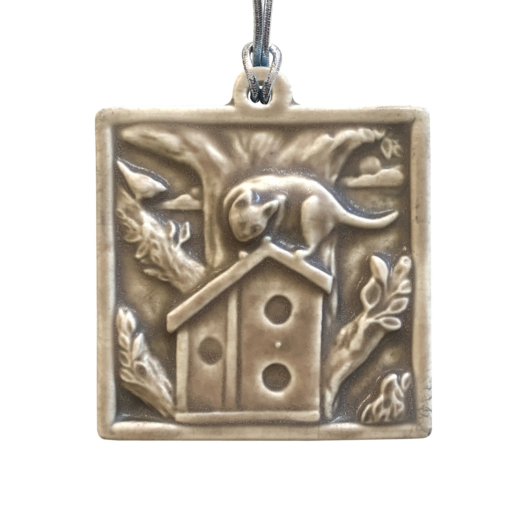 Cat on birdhouse ornament Sepia.JPG