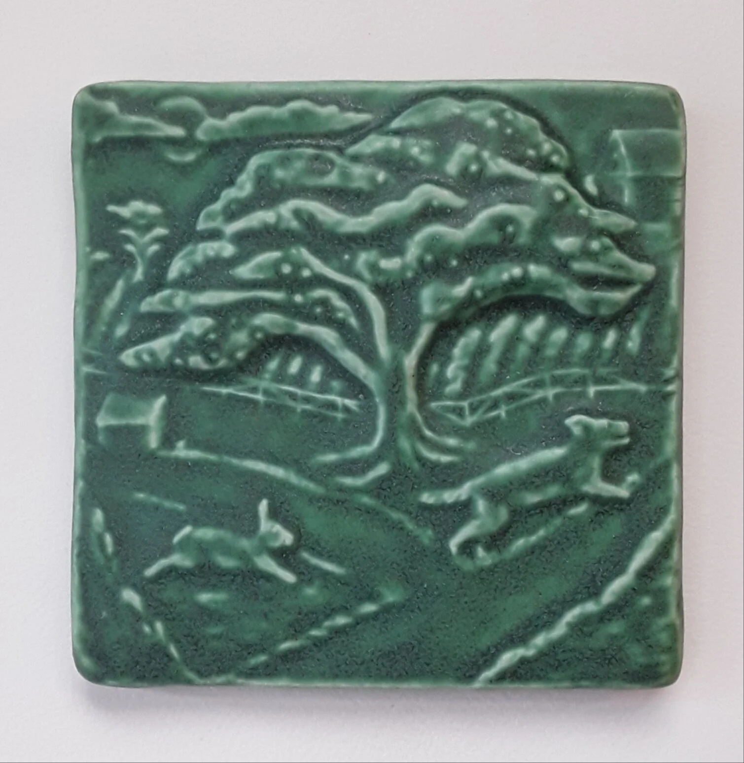 Handmade 4x4 porcelain Rabbit Chasing Dog Art Tile, pet-themed ceramic accent for dog lover kitchen backsplash installation, whimsical home decor.