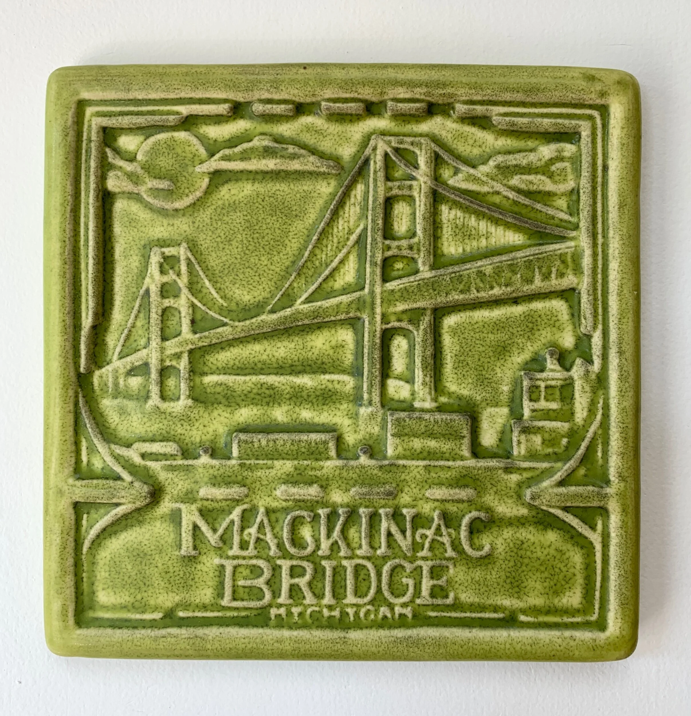 Handmade porcelain Mackinac Bridge art tile. Perfect for kitchen backsplash, bathroom, or home renovation projects. A unique decorative tile, made in Michigan.