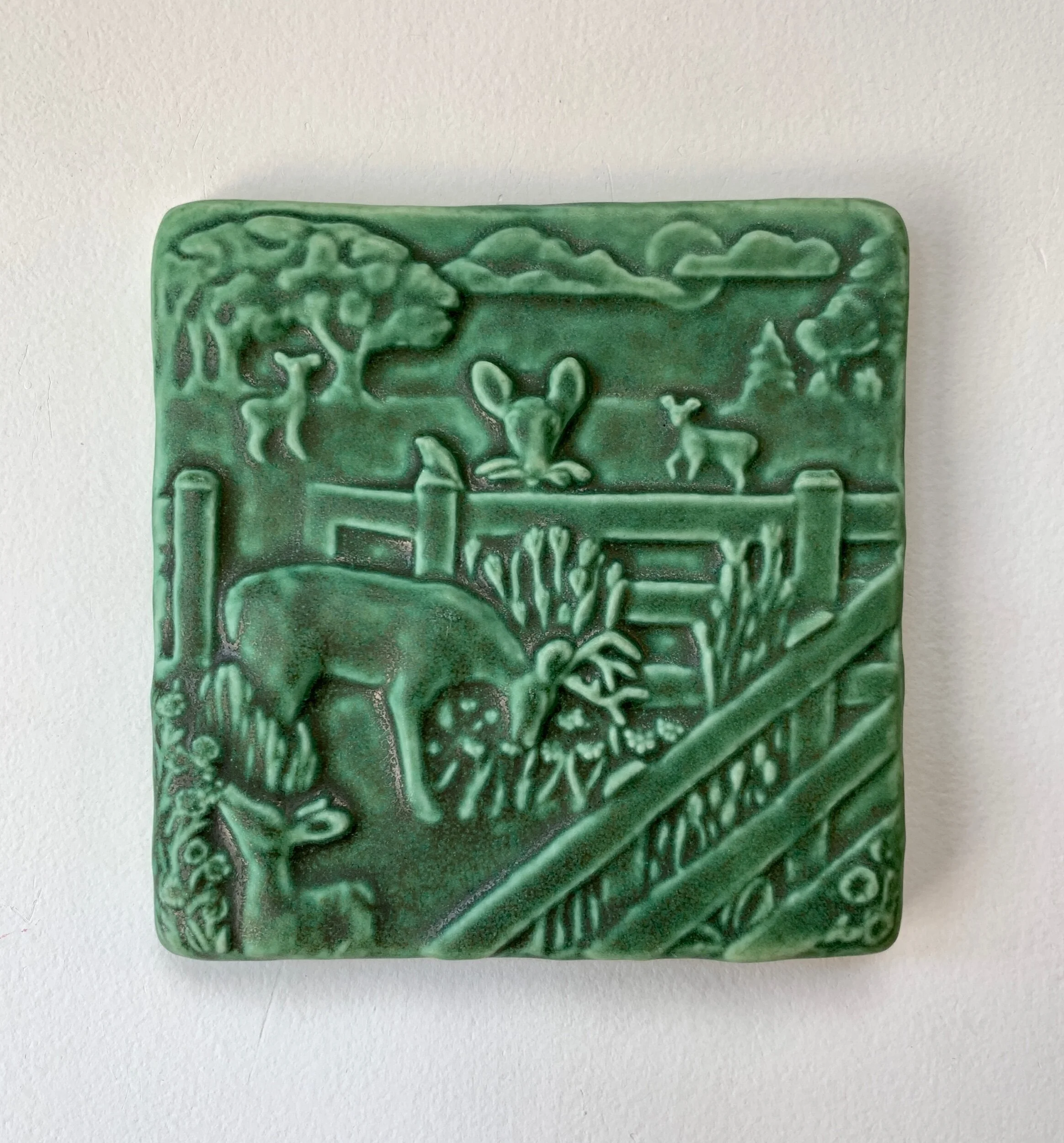 Deer in Garden Art Tile, 4x4" ceramic with raised relief of a fawn, in a glazed finish. Ideal for woodland kitchen sink splash.