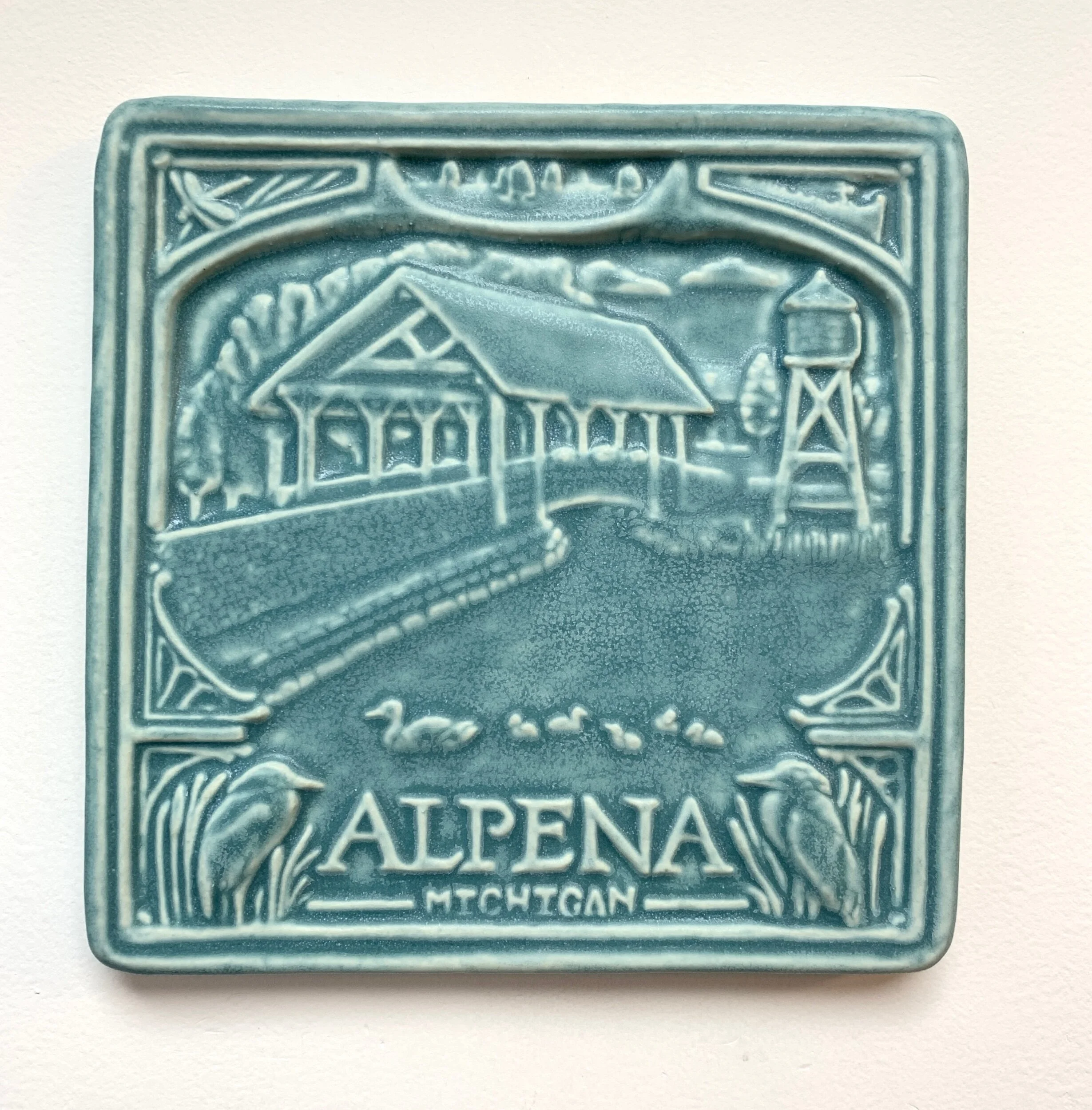 Celebrate Alpena, Michigan with this 6x6" handmade porcelain tile. Perfect for a unique housewarming gift or a permanent backsplash installation. Ships in 2 weeks.