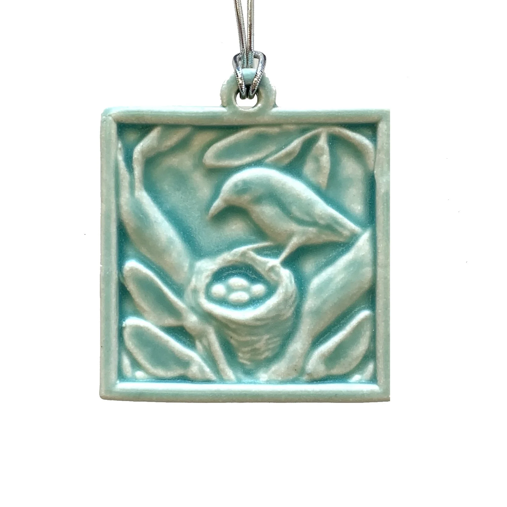 Bird at nest ornament bermuda.JPG