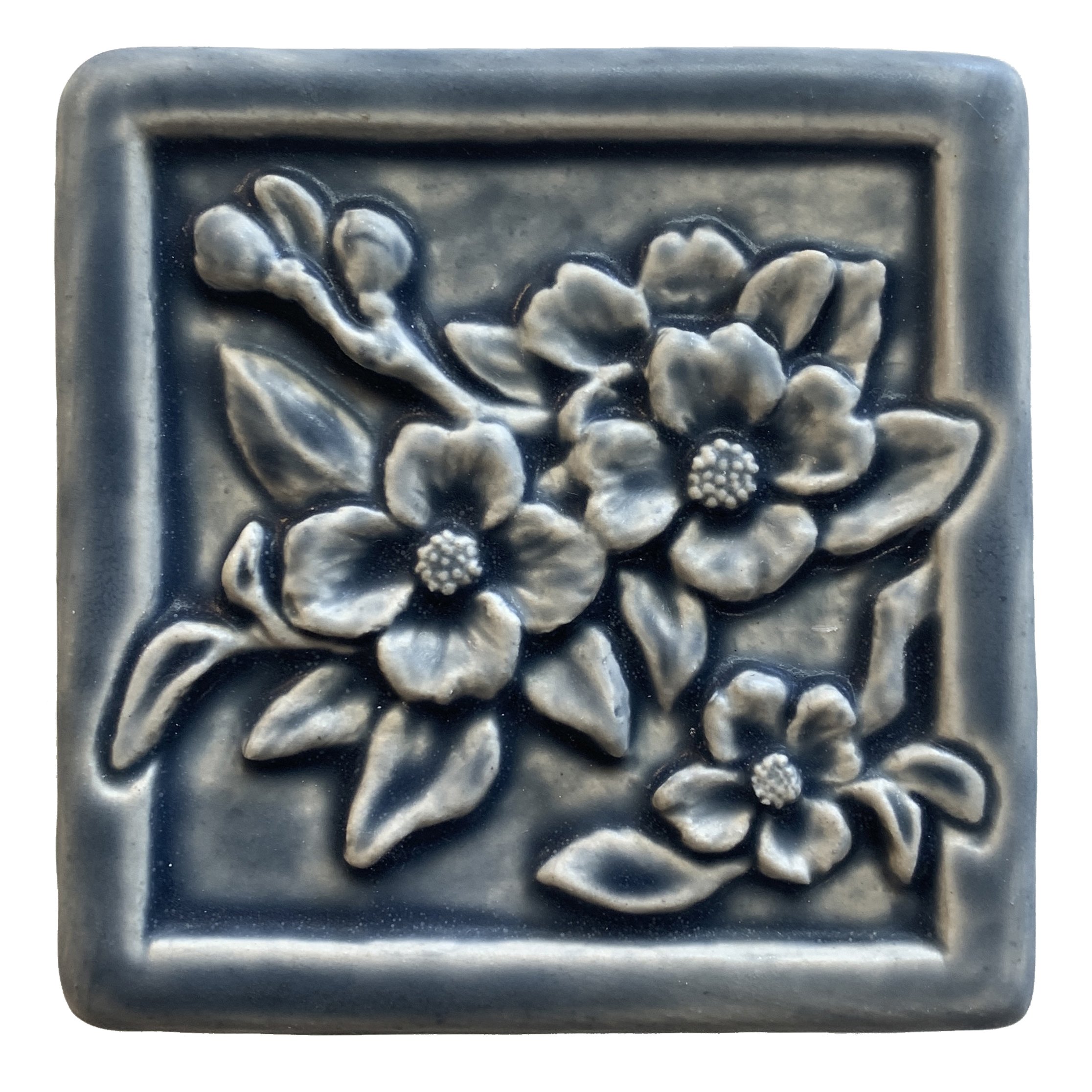 Handmade 4x4 porcelain Dogwood art tile with high-relief floral detail. Michigan artisan ceramic for kitchen backsplashes and botanical wall decor. Moisture-resistant spring garden gift.