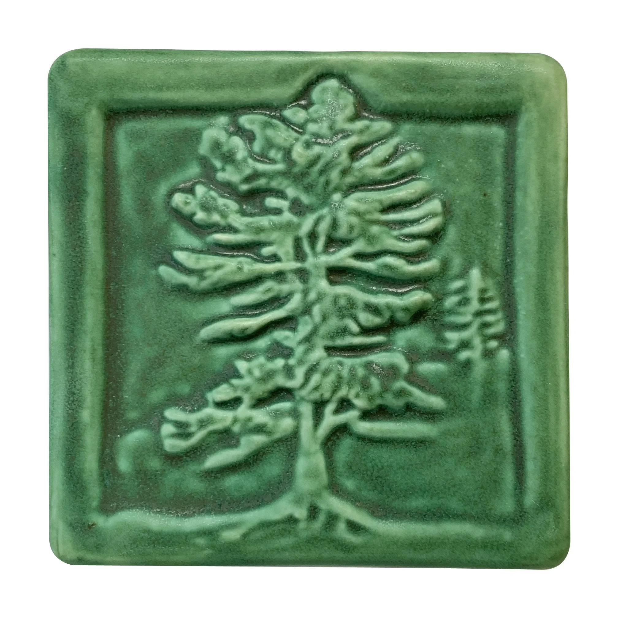 Handmade 4x4 porcelain White Pine art tile with high-relief needle detail. Michigan artisan ceramic for kitchen backsplashes and woodland wall decor. Moisture-resistant evergreen nature gift.