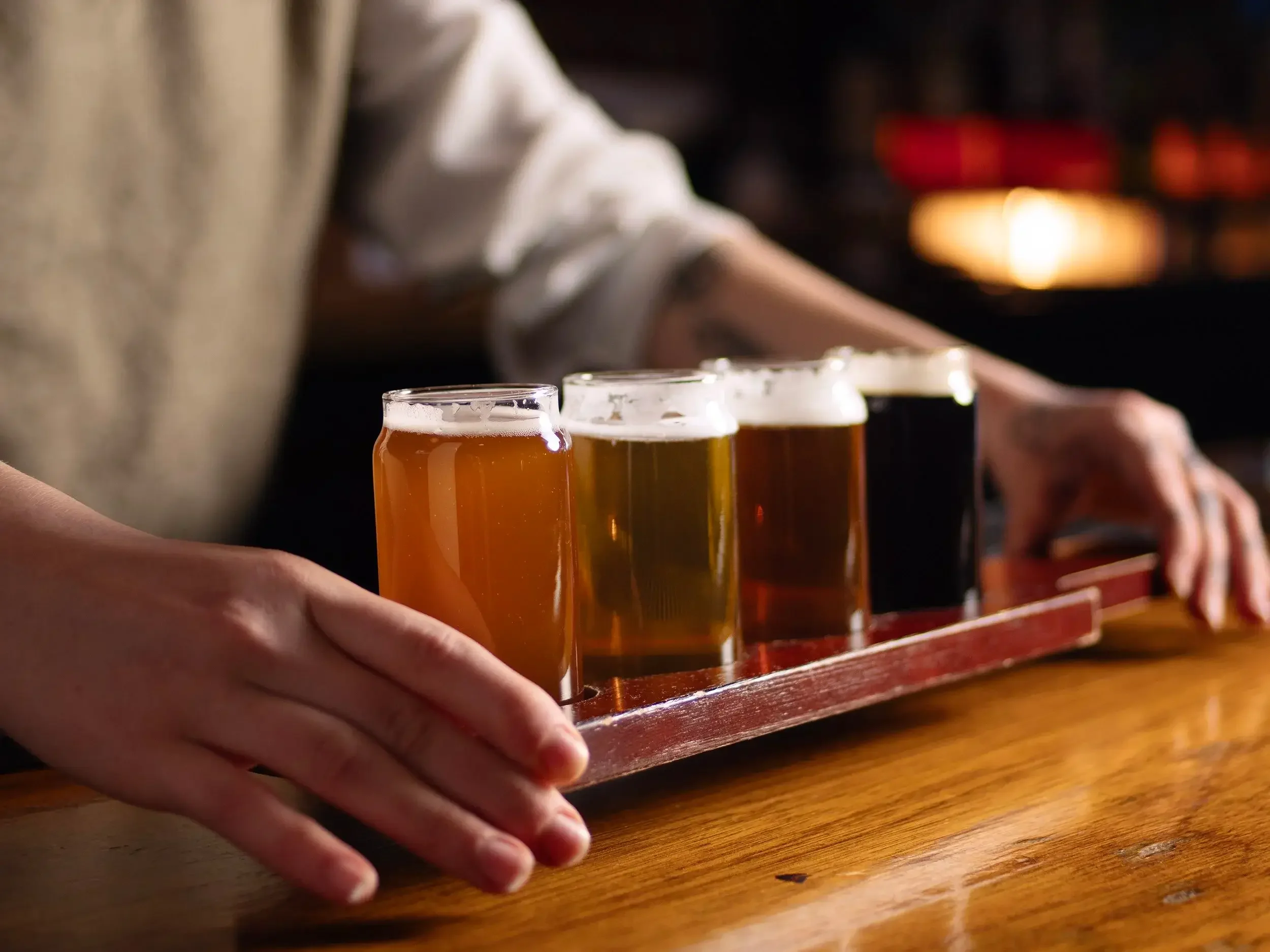  A bartender serves a flight of four different beers at the bar at the Dutch Ale House in Saugerties, NY. 