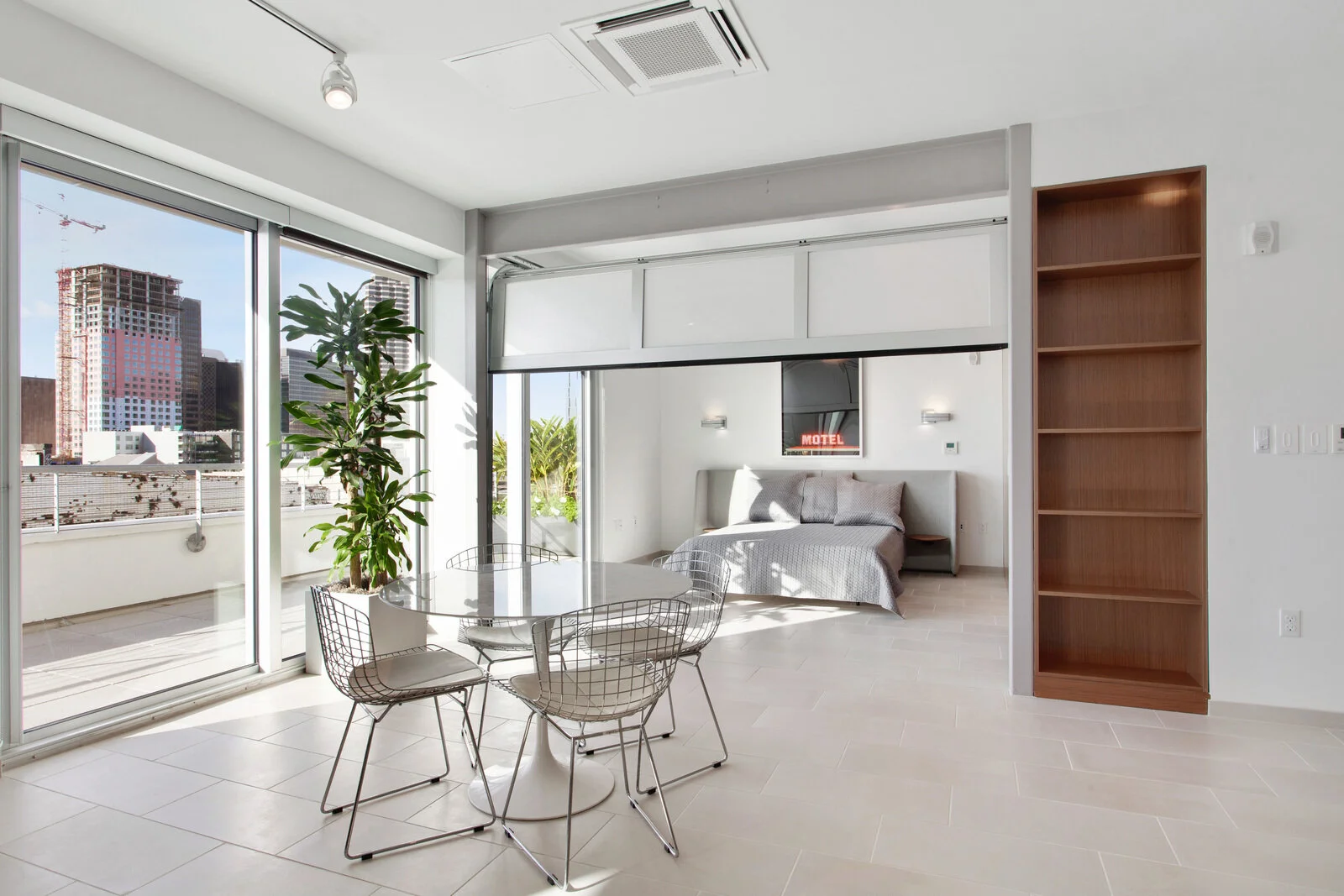  Luxury Apartments in New Orleans LA - The Garage Dining Area with View of Balcony and Bedroom 