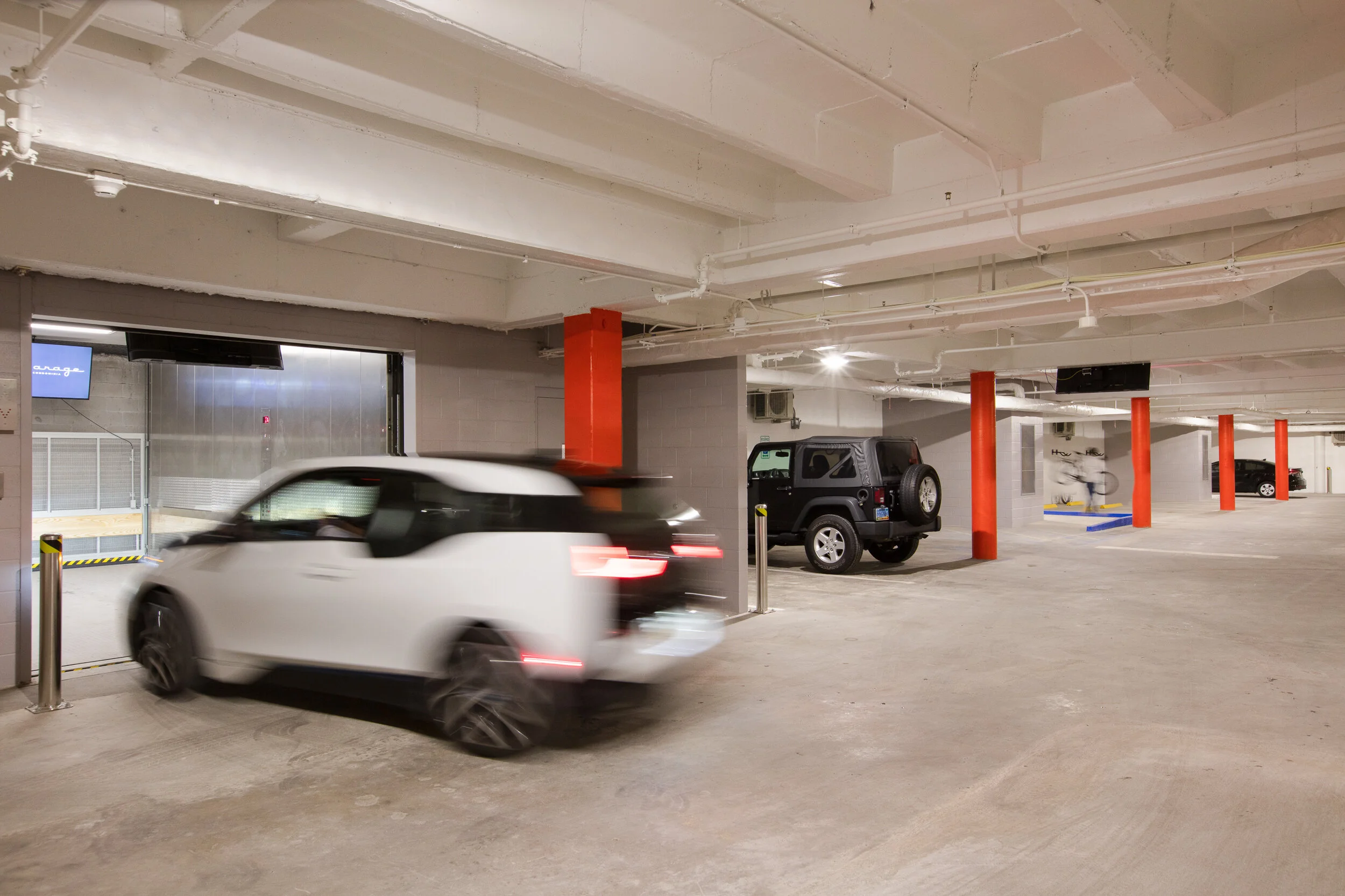  A car entering the vehicle elevator of condominium provider The Garage in New Orleans, LA 