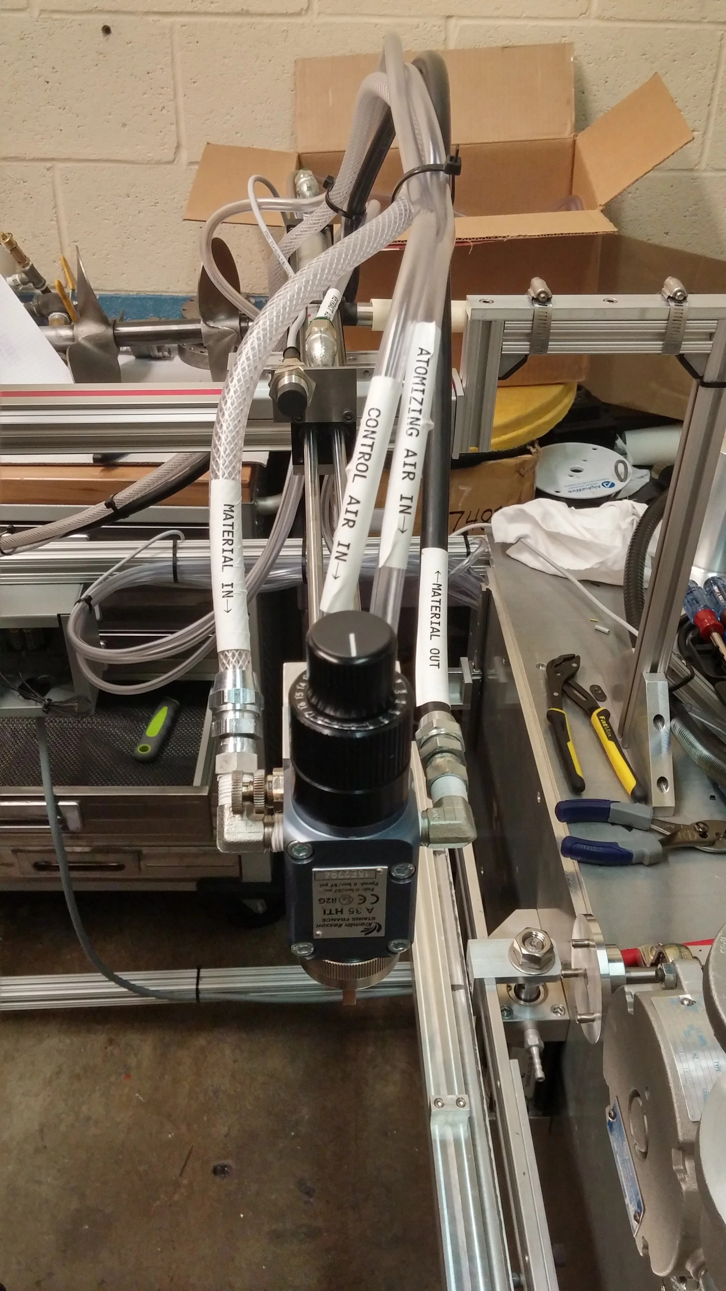 Pneumatic fluid and air lines attached to the applicator
