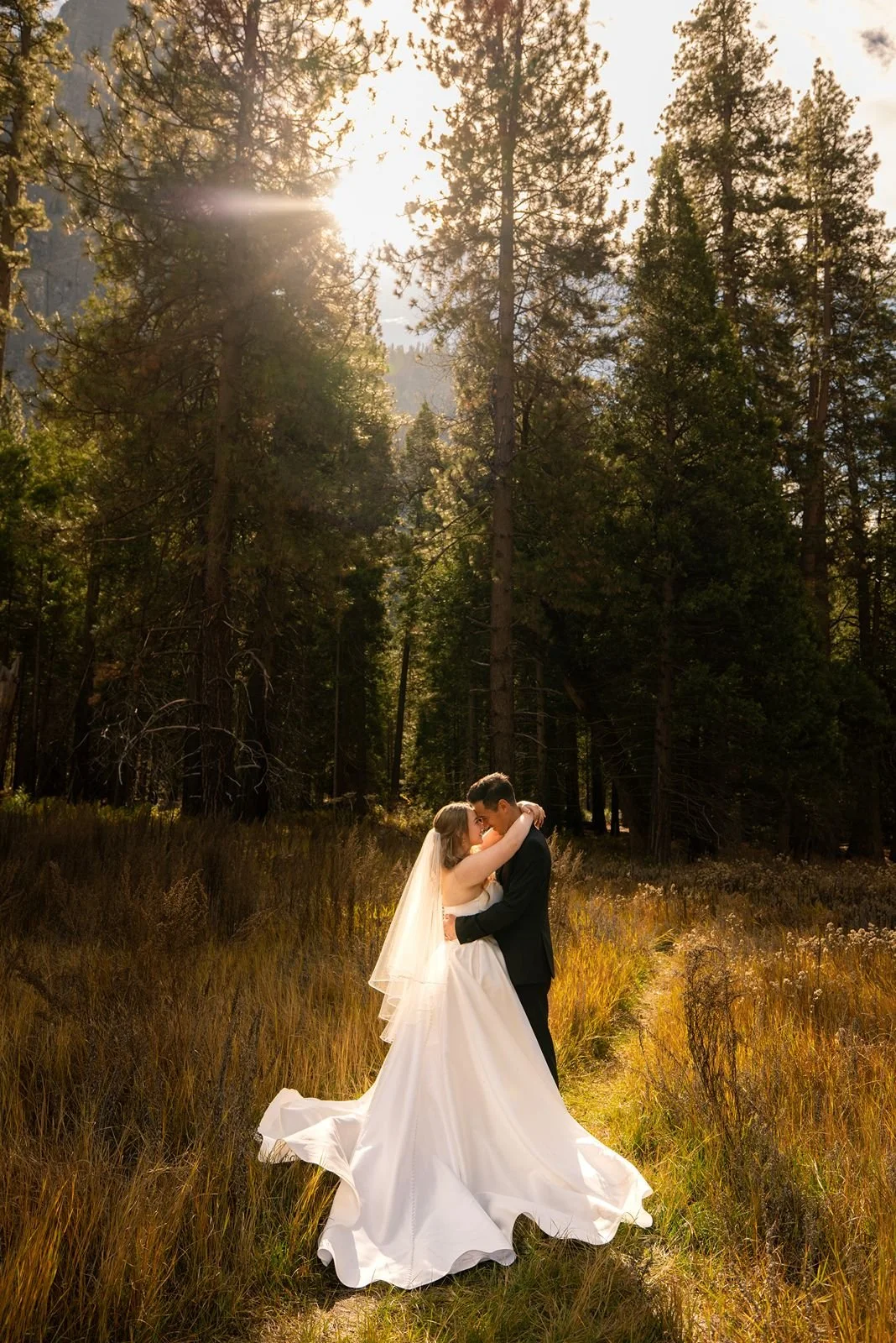 Bride and groom in Yosemite meadow for sunset wedding portriats