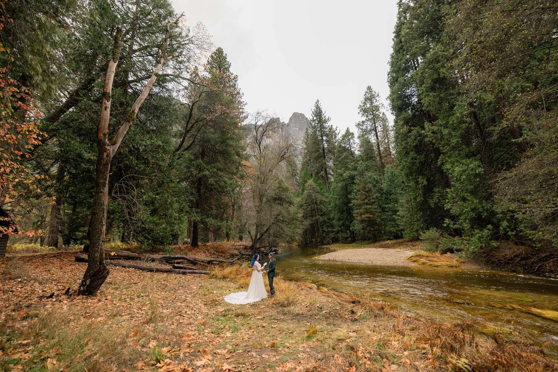 A romantic elopement scene in Yosemite, featuring a couple with stunning natural landscapes in the background.