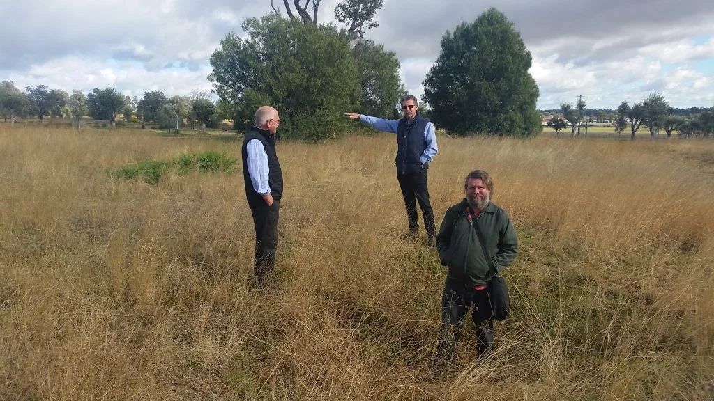 Garry McDougal, Rick Hutton and Alex discuss his proposal to dig a hole as a permanent artwork at the living classroom. Alex is standing in a hole dug a hundred years ago by prospectors testing for gold. We thought it might be a perfect location, given that the work has already been started for us. photo Laura Fisher