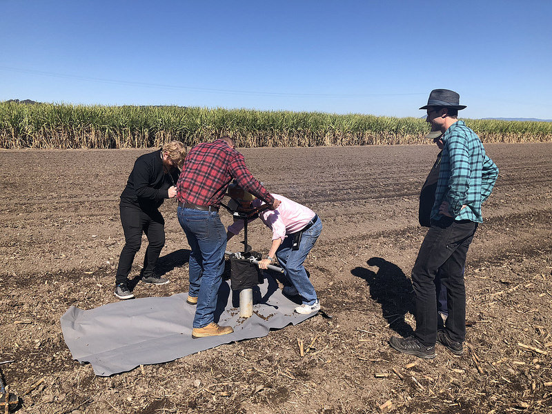Allan Yeomans and his assistant Darren collecting a soil sample from Robert Quirk’s sugarcane farm in the Tweed region of Northern NSW. Robert was the winner of 2014 Carbon Farmer of the Year .