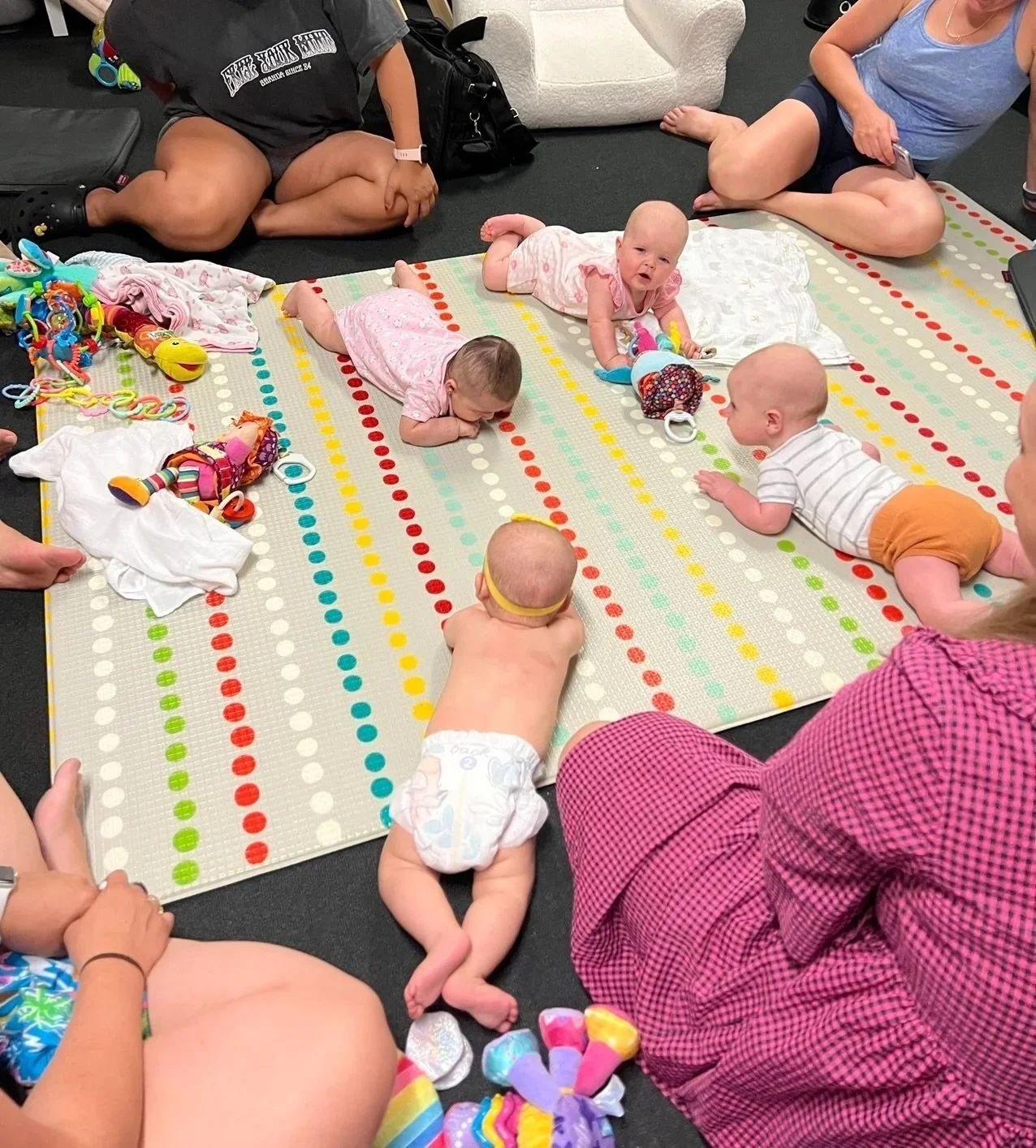 Babies lying on their tummies in their Mother's Group