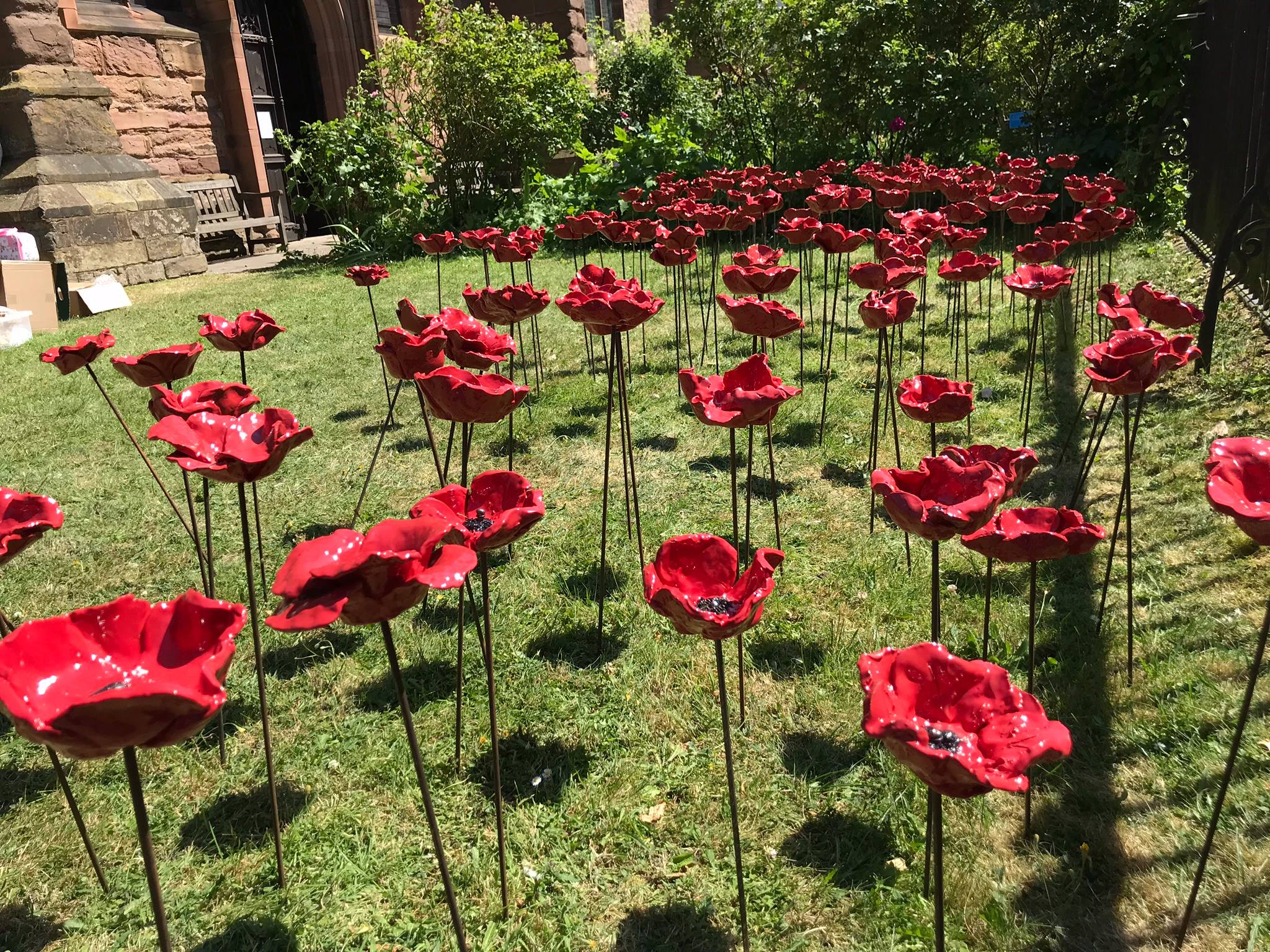 The beautiful garden of poppies at St Laurence's Church, Ludlow