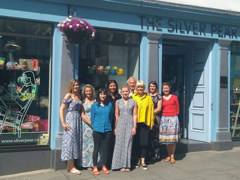 Janet with her dream team outside the shop