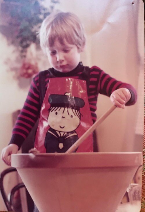 Henry showing his enthusiasm for Christmas cake from an early age