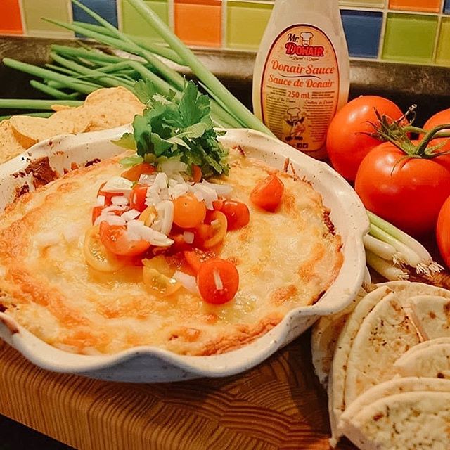 A Nova Scotia tradition....Donair dip or #HaliDip! Have you tried it?
This delicious recipe adaptation from The Kilted Chef uses our donair meat & sauce in a way that is meant to be shared with friends and family!
NOVA SCOTIA DONAIR BAKE
Serves 4 to 6
1 pkg cream cheese
1 275g pkg “The Original” ™️Mr. Donair meat, shredded
2 Green onions, finely diced
12 cherry tomatoes, diced
½ medium Onion, finely diced
½ cup “The Original”™️ Mr. Donair Sauce
3/4 cup shredded mozzarella cheddar blend
In a medium size bowl mix the cream cheese, Donair sauce, Donair meat and green onions. Transfer to a baking dish, layer with shredded cheese & and bake in an oven at 350F for 20 minutes or till it starts to bubble.
Garnish with cherry tomatoes and onions.
Serve with your favorite dipping bread, pita, naan bread, etc.
Happy snacking from The Kilted Chef & “The Original” ™️ Mr. Donair!
#MrDonair #DonairDip #appetizers #partyfood #festivefood #happyhour #Canadaeh #officialfood #tasteofhome #tasteofnovascotia #donaircountry