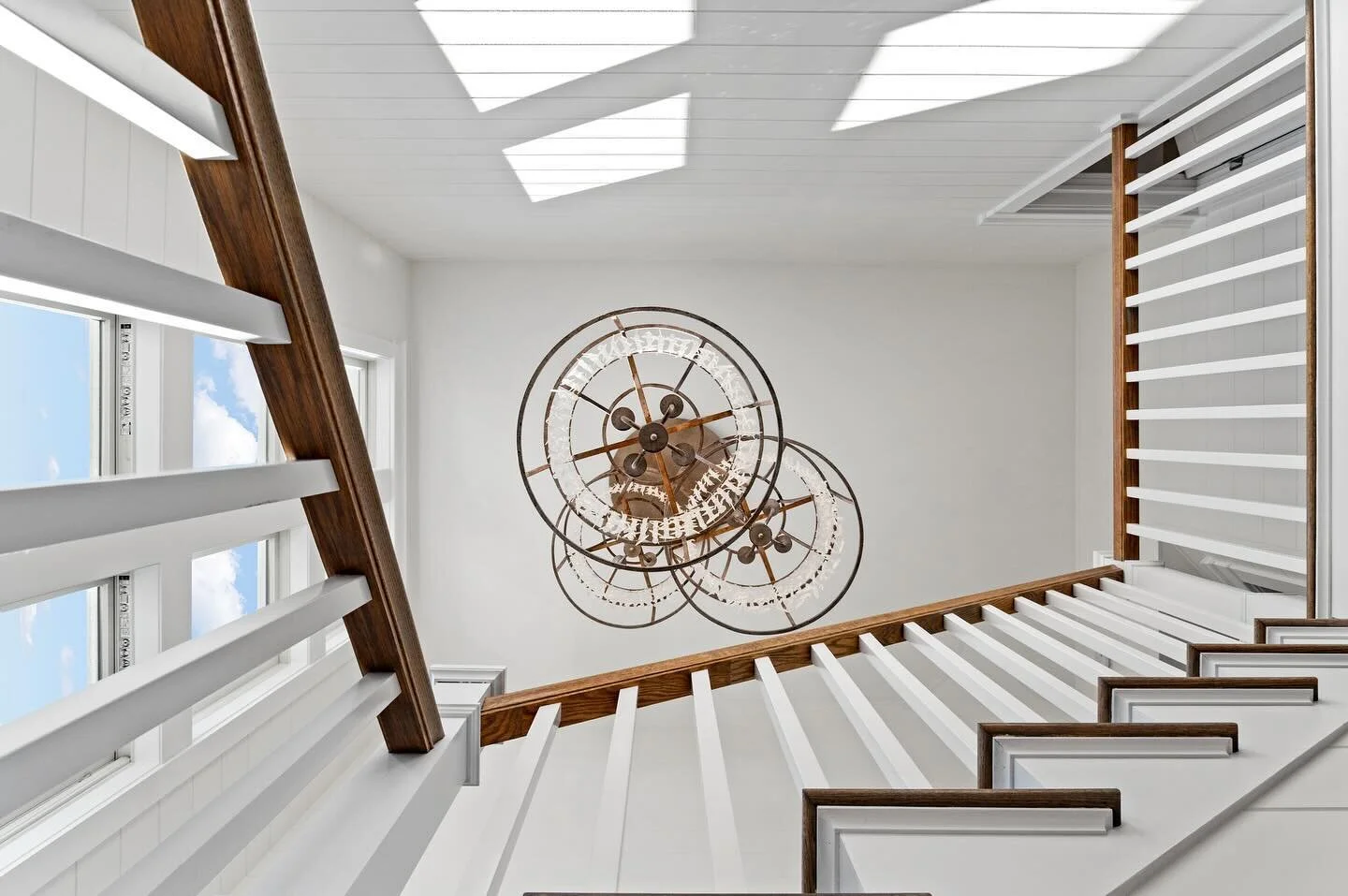 Underneath the shimmering chandelier of crystals and seashells, where elegance meets craftsmanship. ✨🐚

This custom fixture was hand crafted and made from iron, seashells, and beautiful crystal beads for you to see the second you walk into the home 