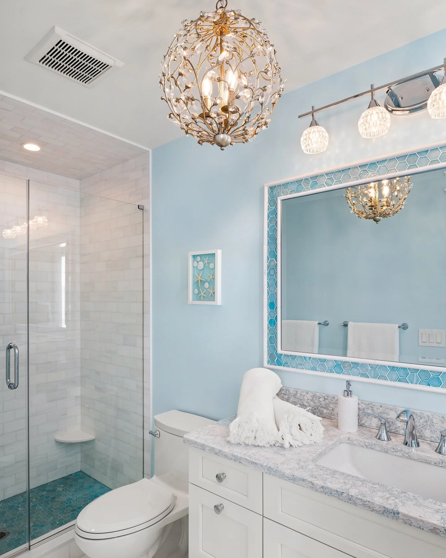 Chandelier in the bath room? Oh yes we did! This sea glass colored restroom for &ldquo;Her&rdquo; definitely sparkles underneath this Curry &amp; Co. sphere chandelier. What a pleasant way to start the morning ✨

Photography 📸: @msparkphoto 

#insta