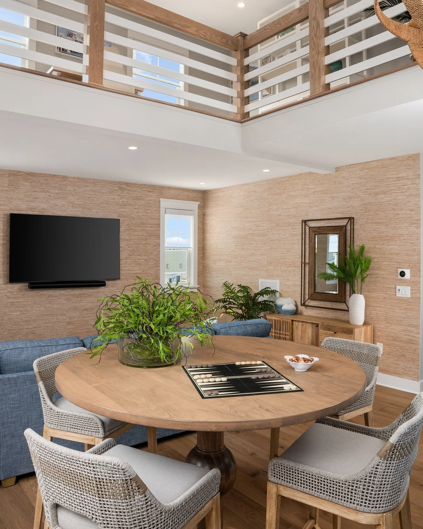 Elevate your gatherings in style🌾✨This bonus room is a masterpiece, adorned with Thibaut&rsquo;s natural grass cloth wall covering and centered around the handcrafted Lancaster Iron and Wood game table. A perfect blend of sophisticated and comfort- 